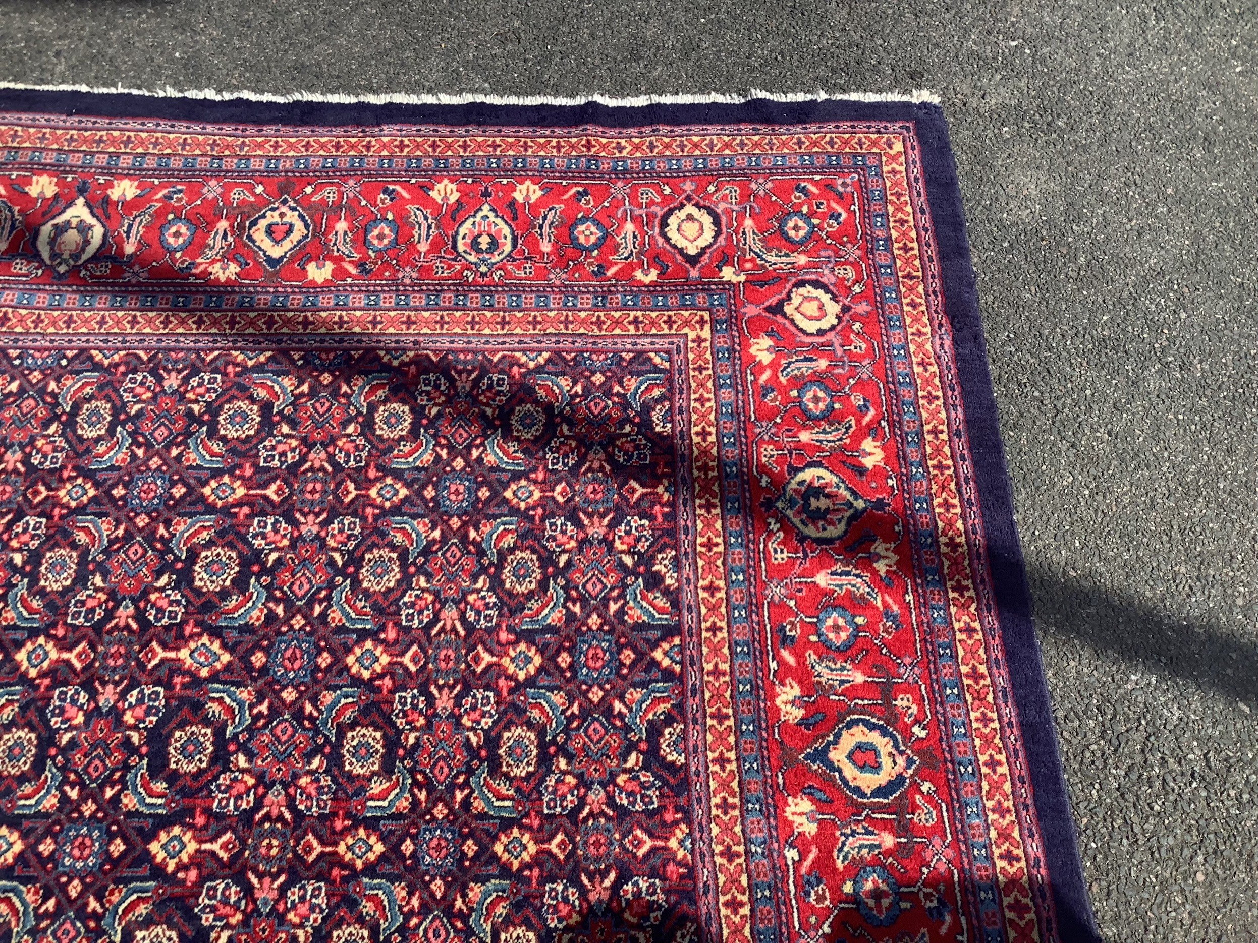 A North West Persian blue ground carpet, 534 x 325cm